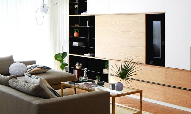 A Modern and Contemporary Home Decor With Unique Features | The unique steel and oak storage piece in the living room brings out the best of the modern design, an incredible creation in Israel's Central District. #interiordesign #homeinteriors #moderndecoration #contemporarydecor #israeldecor