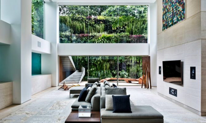 Ever Wished of Having a Pool Inside Your Home? Here's How | In an outstanding residence in São Paulo, Brazil, swimmers can be seen from the room through thick glass panels, like fish in an aquarium. #interiordesign #innovation #insidepool #homedecor